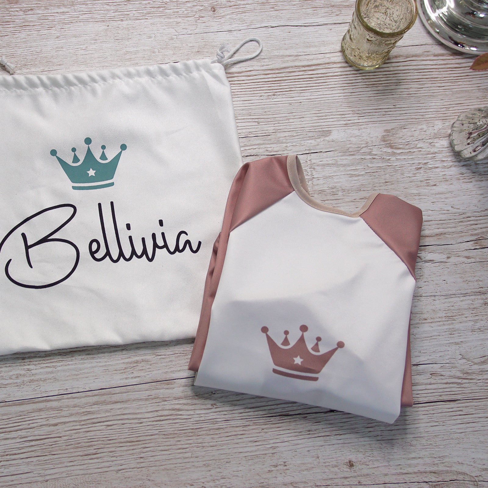 Soft bib pink with long sleeves (crown) incl. carry bag