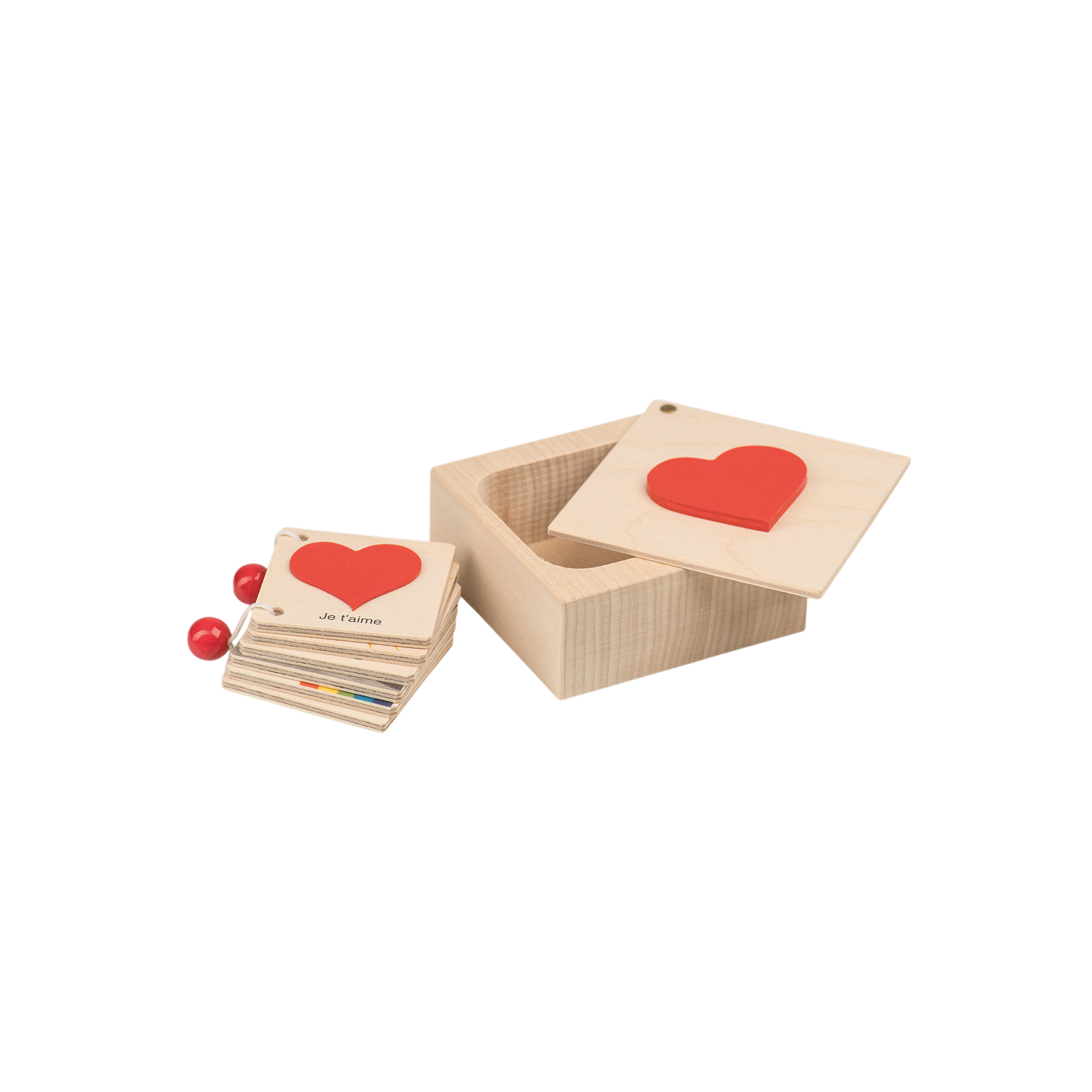 Petits livres en forme de cœur dans une boîte en bois Français