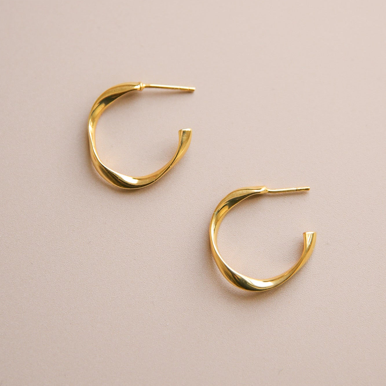 Gold ear stud loop